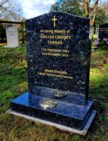 Back and gold headstone by Prince stone masons